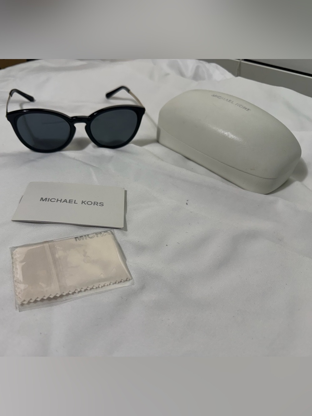 Michael Kors women’s Black Frame Sunglasses with Dark Lenses